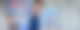 Frank Bremser steht vor einem Banner mit dem Logo von "Neues von der Märchenküste" und hält lachend ein Buch in die Kamera.