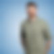 Maik Brockstedt steht vor einem blauen Hintergrund und lächelt in die Kamera