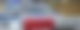 Hinter einer Polizeiabsperrung steht ein Polizeiauto mit Blaulicht
